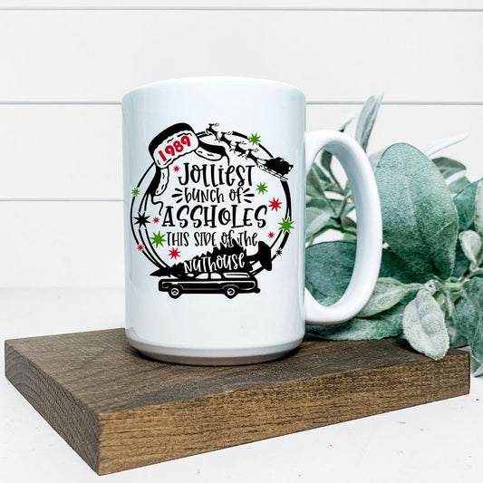 JOLLIEST BUNCH OF ASSHOLES THIS SIDE OF THE NUTHOUSE MUG Harlow Boutique Official Online Store 